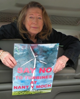Angela Kelly holding poster